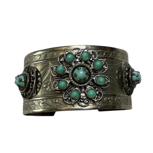Fabulous cuff bracelet with engraved designs on sterling silver. The turquoise beads are perfectly intact. Circa 1970’s.