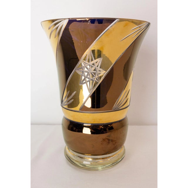 Vintage vase typical of the sixties. Bronzed and gilded glass with engraved stars. French circa 1960. Good vintage...
