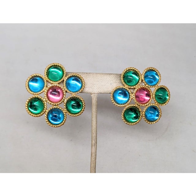 1992 goldtone center cabochon pink rhinestone surrounded by cabochon green and aqua blue rhinestones in the shape of a...