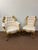 Carved solid wood gilded gold chairs with custom creme baroque upholstery. Side arm chair has one small piece of wood...
