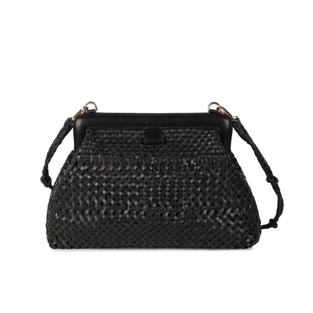Frame clutch in woven black leather. Lined with inside zipper pocket and detachable shoulder straps.