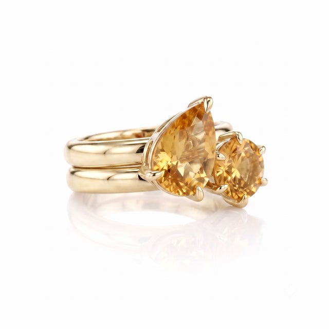 Brighten your jewelry collection with the warm, sun-kissed glow of this radiant two-piece stack. Featuring two beautifully...