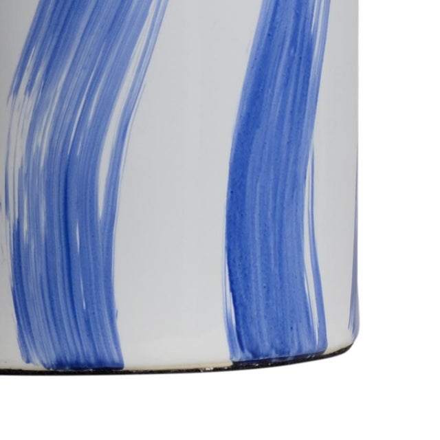 Wonderful White Glazed Ceramic Cylinder Vase With Hand Painted Blue Accents. Clean with a dry cloth