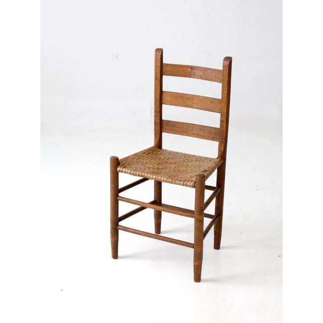 This is a beautiful antique splint weave seat chairs. The rustic, natural wood chair features a ladder back and splint...