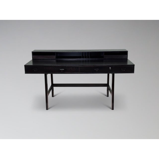 We are proud to offer this iconic teak flip-top partners desk attributed to Jens Quistgaaard for Løvig Design. Featuring a...