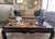 This striking coffee table is a premier example of Postmodern design, blending traditional Asian architectural elements...