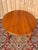 Louis XVI style cherrywood table comprising a 115 cm diameter tabletop and a 58 cm extension leaf. Six legs ending in...