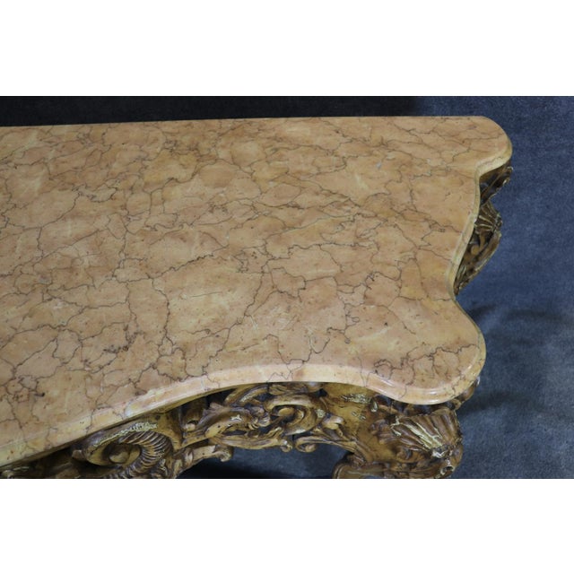 Measures: 38 7/8" h x 72 3/4" w x 24 3/4" d There is a certain confidence in a true French console — the kind that does...