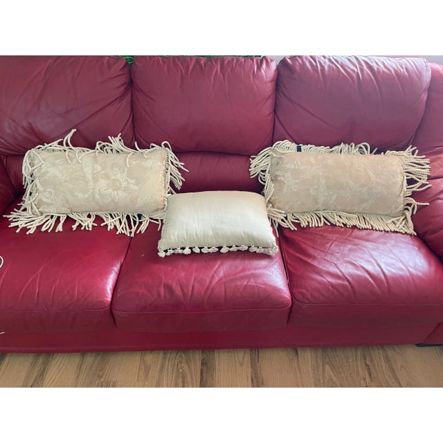 Set of 3 beige brocade textile lumbar pillows with fringes. Baroque angels textile.21” by 15”.