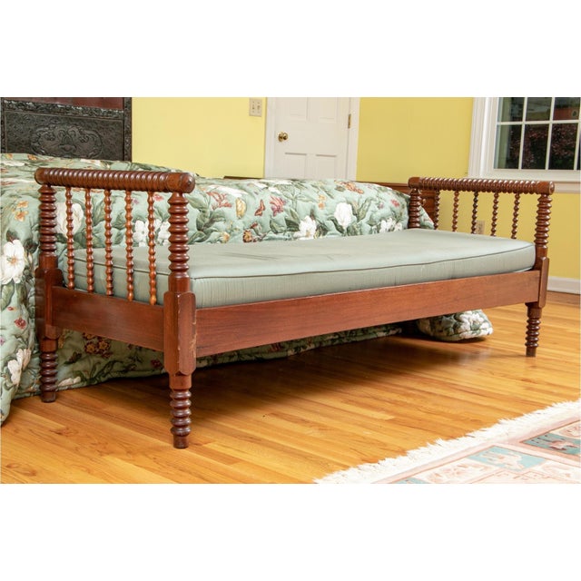 Early 20th Century bobbin-turned walnut bedside bench or daybed with a cushioned seat with an adjustable head- or foot-...
