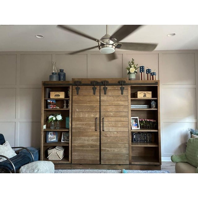 The unit is constructed by artisans hand-planed solid oak grown and harvested in America. Each section is hand-finished...