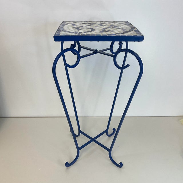 Vintage Home is pleased to offer this 1980s tile mosaic top outdoor garden plant stand in shades of blue. We’ve given it a...