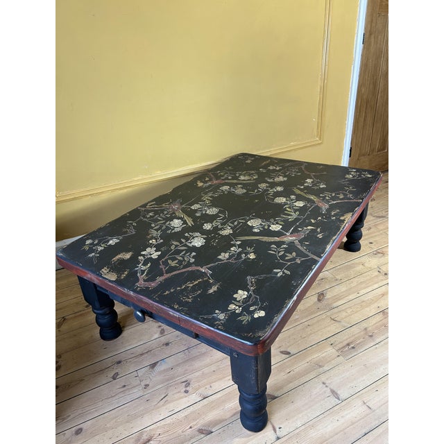 Stunning large painted pine coffee table. We have added chinoiserie flower design. The table has a lovely aged patina .