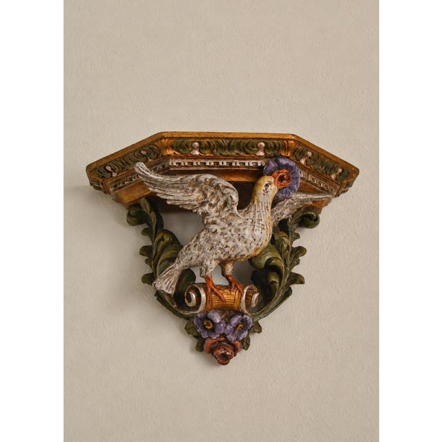 A rare and highly decorative antique Italian wall console, beautifully carved in wood and hand painted in rich aged tones....