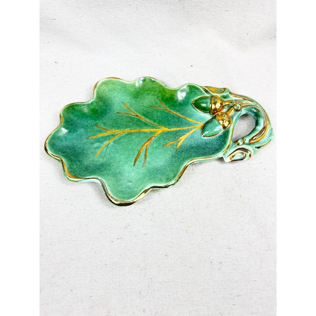 Bring mid-century charm and rich personal history to your tabletop with this exquisite, handmade ceramic oak leaf and...