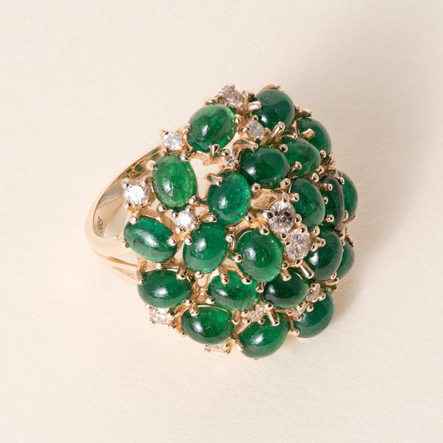 Emerald Cabochon & Diamond Cluster Ring in 14K Yellow Gold Circa 1990s A striking pop of color and texture, this vintage...