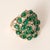 Emerald Cabochon & Diamond Cluster Ring in 14K Yellow Gold Circa 1990s A striking pop of color and texture, this vintage...