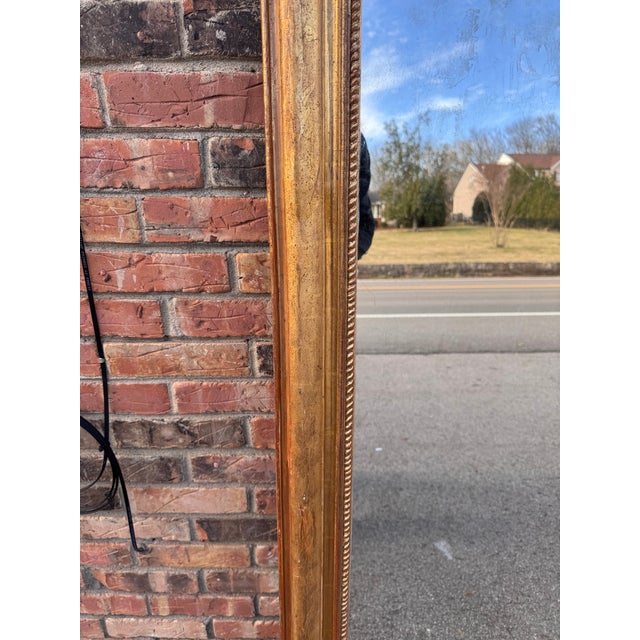 This 19th Century French mirror is top of its class! With its stunning gilded adornments such as its hand carved floral...