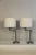 A pair of Henson style swing are lamps. Simple and stylish Hanson was known for. These lamp lend themselves to same genre....