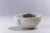 Irregular, dramatic gray cracks of bold visual impact embellish the polished ceramic surface of this spectacular chawan...