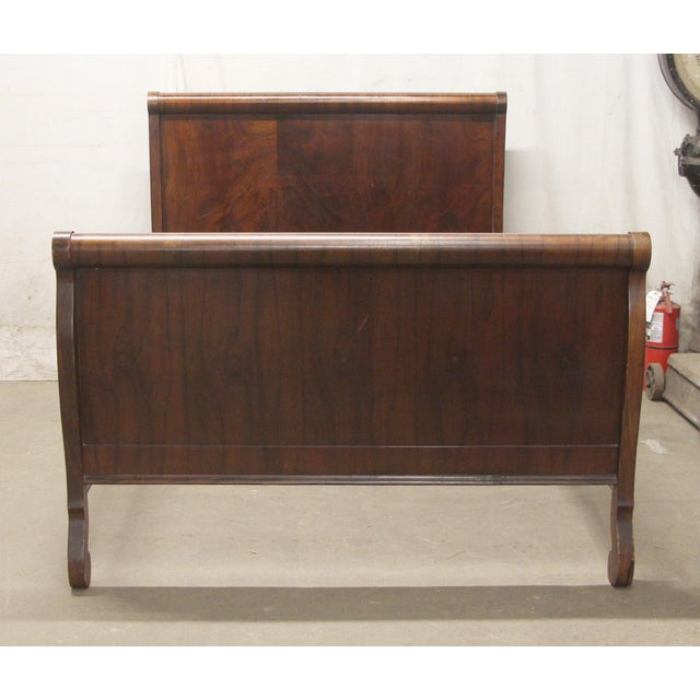 Solid walnut full size sleigh bed with walnut veneer. The rich dark tones and gentle curves give this bed frame a refined...