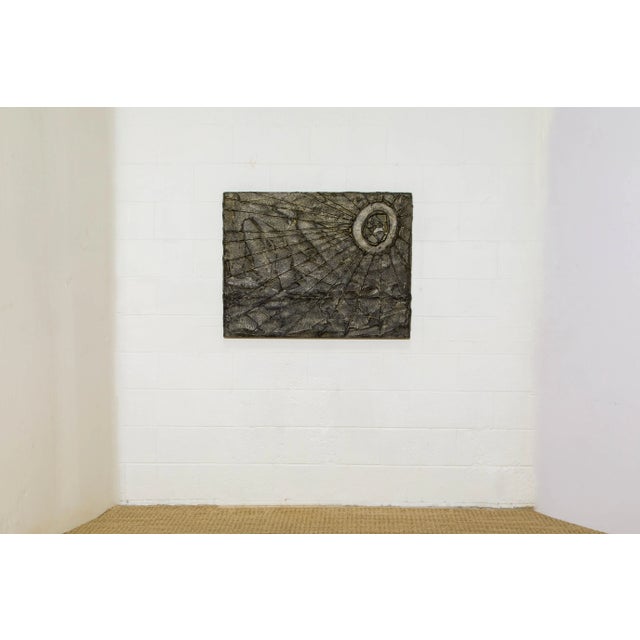 This unique brutalist wall relief was sculpted with bronzed resin over wood, in the style of Paul Evans, circa 1970s....