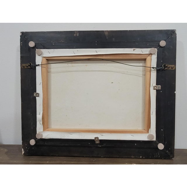 This oil painting depicts ships in a harbor, framed in a gold frame. The impressionistic artwork captures nature and...