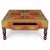 This is a mid-century Anglo-Indian style carved teak and brass inlaid coffee table. It is known as a Pooja Chowki or low...