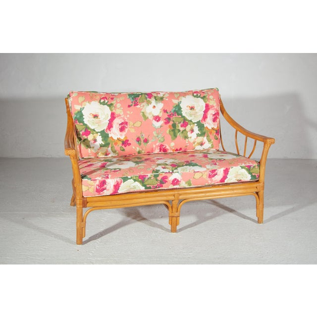 Very stylish quality vintage bamboo sofa, two-seater. The two-seater has renewed upholstered cushions in a soft color...