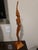 An extraordinary, gallery-grade mid-century Balinese modernist sculpture depicting an elegant elongated maiden. Standing...