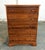 This cherry chest features five generously sized drawers with simple wooden knobs and attractive natural grain variation...
