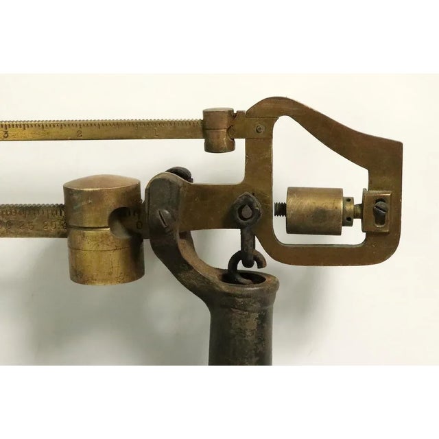 Nice industrial style antique balance scale by Fairbanks. This scale features a cast iron base platform, with solid brass...