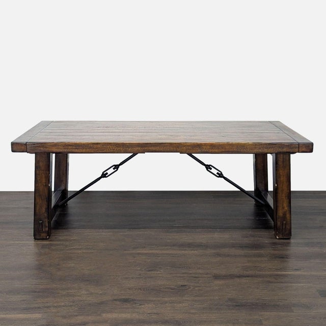 This Pottery Barn dining set includes a sturdy rectangular table, five matching chairs, and a spacious bench. The set is...