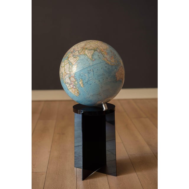 Mid century modern world map National Geographic globe with smoked lucite floor stand, circa 1976. This piece rotates on a...