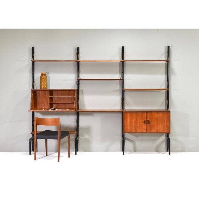 Elegant wall-unit by Louis Van Teeffelen for WéBé (Walraven & Bevers), Netherlands – circa 1950. Please note: The chair is...