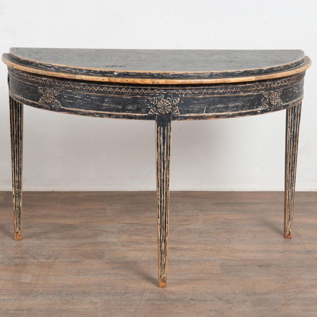 19th century Swedish demi lune side table, crafted in pine. The table has been given a newer professionally applied black...