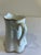Chairish Description: This dainty porcelain creamer by Thomas, Germany, features a graceful fluted body, scalloped rim,...