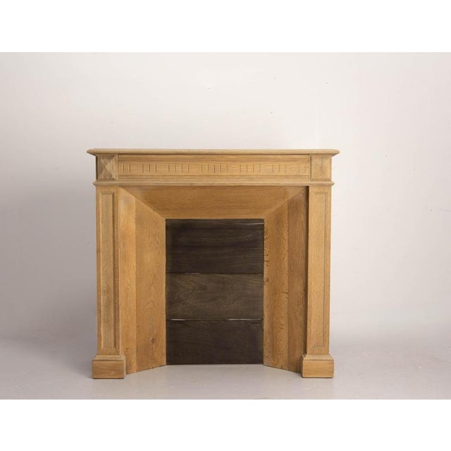 Molded Oak Fireplace Mantel, circa 1890 An oak fire place mantel dating from the late 19th century, circa 1890, featuring...