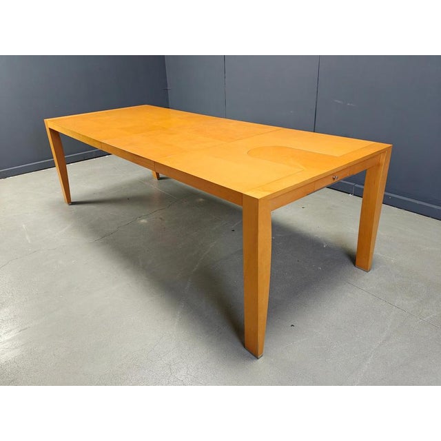 Elegant cherry wood dining table designed by Chi Wing Lo for Giorgetti. Beautiful sleek design with a fantastic...