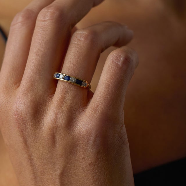 This beautiful vintage sapphire and diamond band ring is a lovely 1990’s design, offering a refined mix of rich color,...