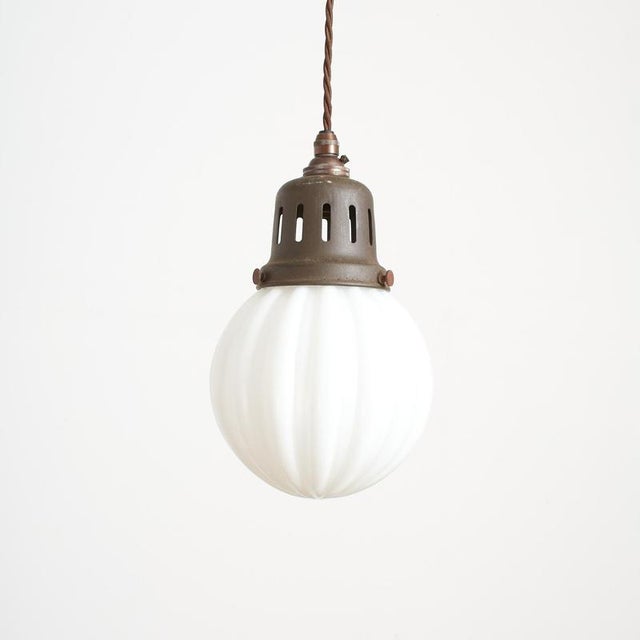 An original opaline glass pendant light salvaged from devon church . The light has a milk glass opaline shade and an...
