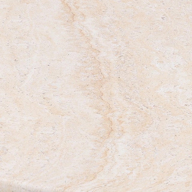 Modern faux travertine coffee table made from lightweight concrete material. Minimalist round design with simple pedestal...