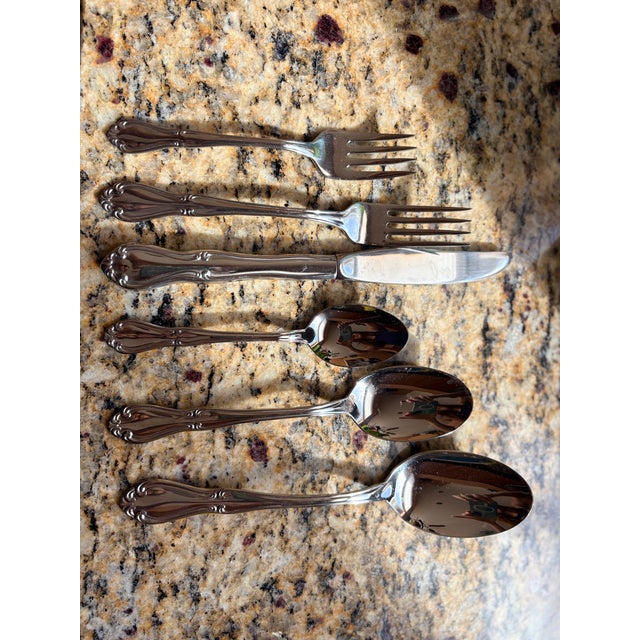 This Stainless steel set is from 1967. Used like new. Glossy Finish: It is as shiny as polished silver as it has been...