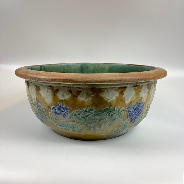 A beautiful large floral bowl that could be used as a planter. This was likely used as a small goldfish bowl in the past....