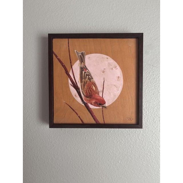 This artwork depicts a house finch perched delicately on a slender branch, set against a softly rendered circular backdrop...