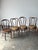 This set of seven bentwood café chairs carries the kind of story that makes vintage worth chasing — brought home by their...