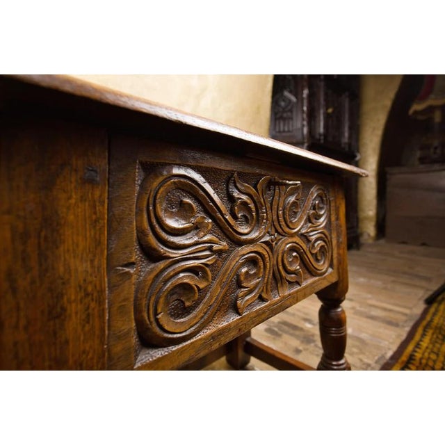 Decorative chest made of solid oak wood, dating back to the 19th century. The front is decorated with a distinctive hand...