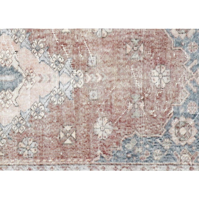 Hand-woven wool rug from Turkey's Oushak region, measuring 4'5" x 8'3". Features bold geometric designs and soft color...