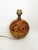 The lampshade is not included. A us adapter is provided. Spherical table lamp in brown painted glass with a golden straw...