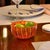 Collection for the table in clear colored glass. It includes tumblers for water and soft drinks, wine glasses, flute...